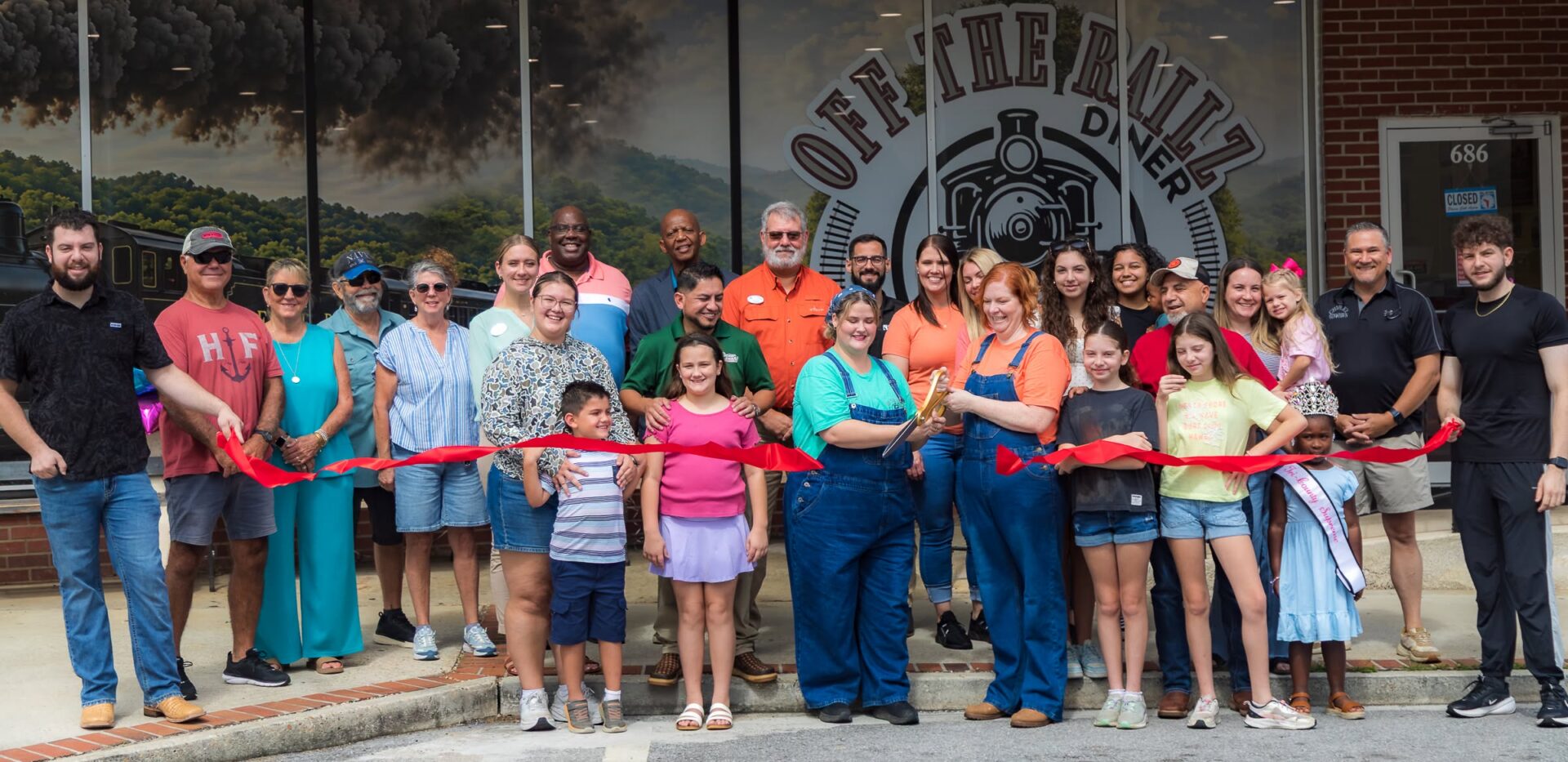 Group at diner ribbon-cutting ceremony. Group at diner ribbon-cutting ceremony.